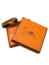 Load image into Gallery viewer, Hermès Clic H Gold + Black Metal Bracelet
